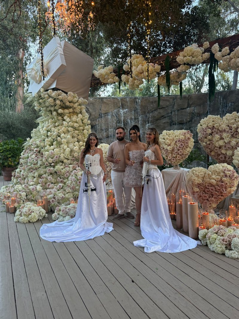 Violin duo with the newlyweds at the ceremony
